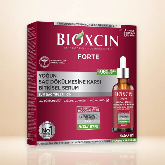 BIOXCIN FORTE hair serum packaging box shown alongside a small bottle of the serum on a clean beige studio background. The box is deep magenta with white and silver text, and the bottle is amber glass with a white dropper cap.