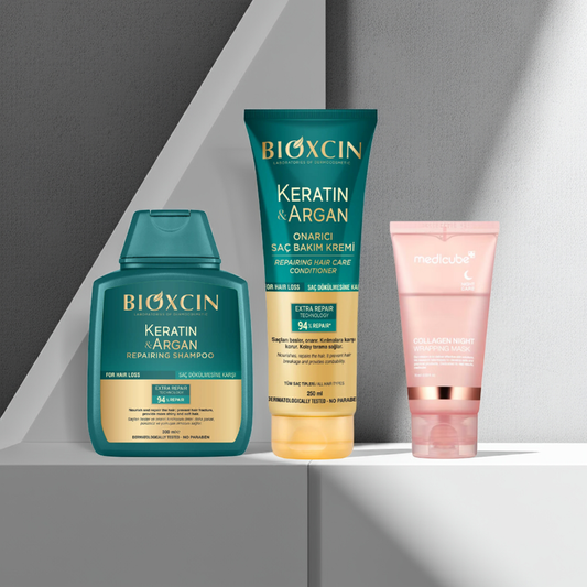 Bioxcin Keratin and Argan Repairing Shampoo and Conditioner and Medicube Collagen Night Wrapping Mask on a grey background