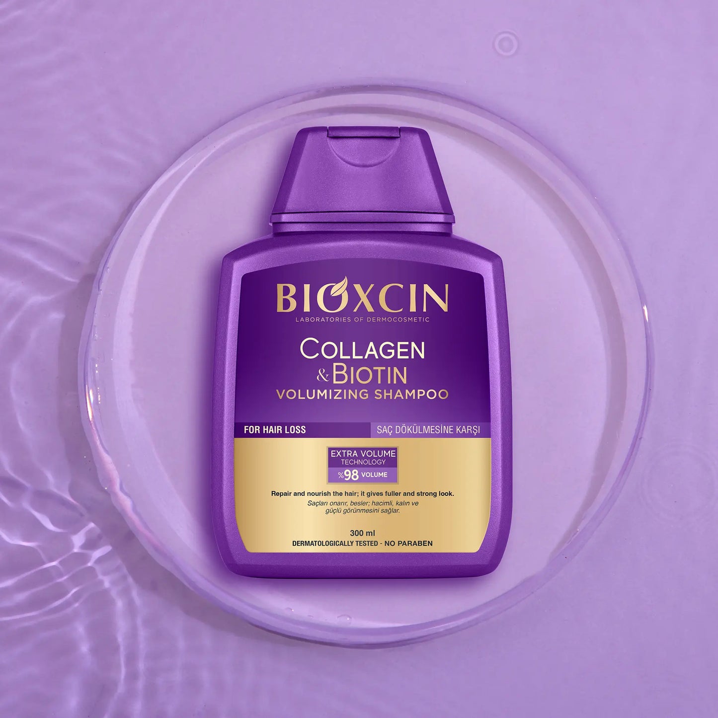 Bioxcin Collagen Biotin Volumizing Shampoo bottle on a purple background