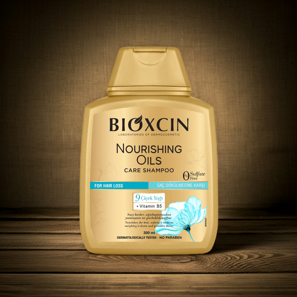 BIOXCIN Nourishing Oils Care Shampoo bottle on a wooden surface with a brown background