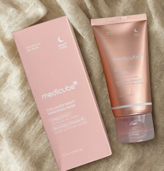 Medicube collagen night wrapping mask packaging and tube on a textured beige background
