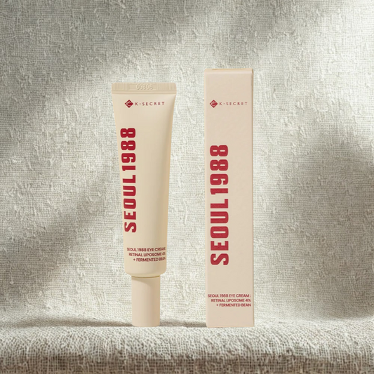 K-SECRET SEOUL 1988 eye cream tube and packaging on a textured gray background