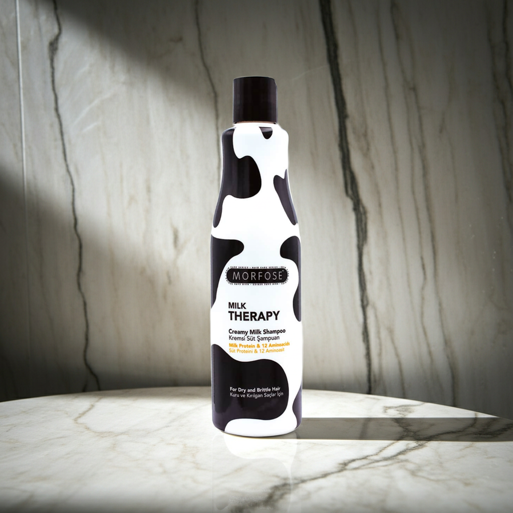 Morfose Milk Therapy shampoo bottle on a marble surface